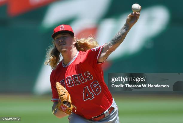 John Lamb of the Los Angeles Angels of Anaheim pitches against the Oakland Athletics in the bottom of the first inning at the Oakland Alameda...