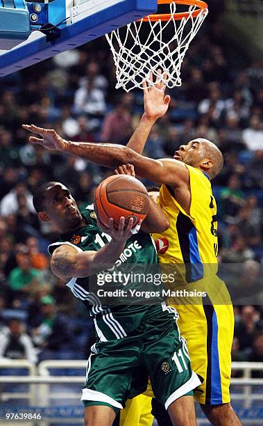 Drew Nicholas, #11 of Panathinaikos Athens competes with Jamon Lucas, #22 of Maroussi BC during the Euroleague Basketball 2009-2010 Last 16 Game 6...