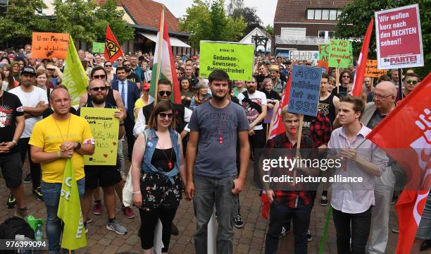 June 2018, Papenburg, Germany: The protest of the right-wing AfD regarding the construction of a mosque in Papenburg is met by a counter-protest of...