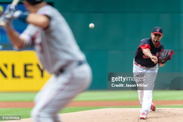 Starting pitcher Carlos Carrasco of the Cleveland Indians pitches to Joe Mauer of the Minnesota Twins during the first inning at Progressive Field on...