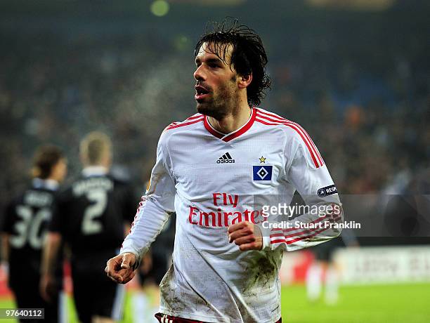 Ruud van Nistelrooy of Hamburg celebrates scoring his teams second goal during the UEFA Europa League round of 16 first leg match between Hamburger...