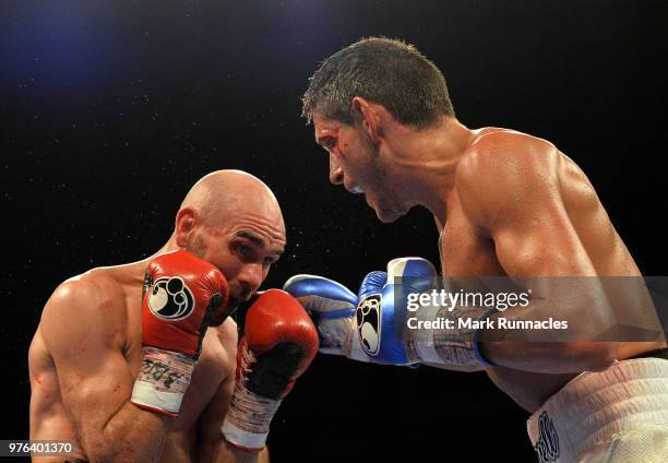 Gavin McDonnell , takes on Stuart Hall black shorts), during the WBC International Super-Bantamweight Championship contest presented by Matchroom...