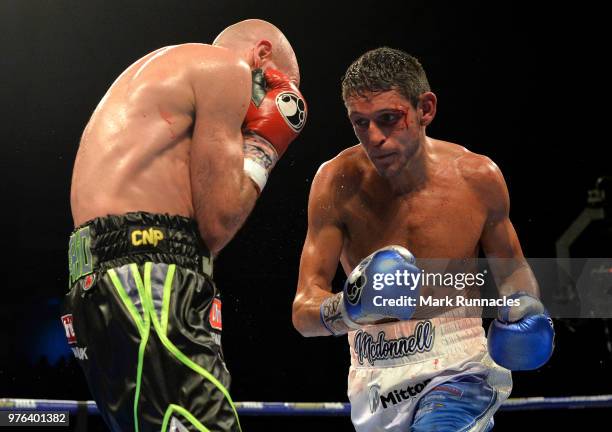 Gavin McDonnell , takes on Stuart Hall black shorts), during the WBC International Super-Bantamweight Championship contest presented by Matchroom...