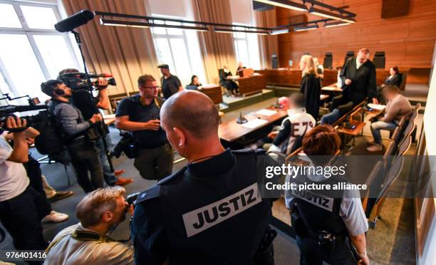 June 2018, Freiburg, Germany: The mother accused of child abuse stands in the court room. She and her partner are suspects of grevious abuse,...