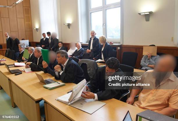 June 2018, Hagen, Germany: The defendants sit in the court room during the trial regarding 15 cases of robbery against money transporters. Seven...