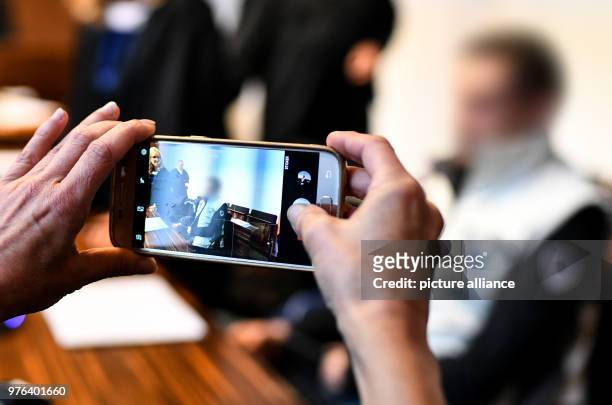 June 2018, Freiburg, Germany: The partner of the mother accused of child abuse is photographed inside a district court room. He and the boy's mother...