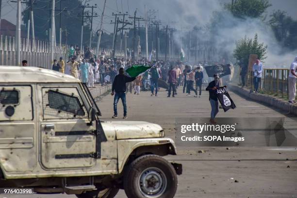 Kashmiri Protesters waving Flags Amid Clashes in Srinagar on Saturday after Eid ul-Fitr Prayers. Government Forces in Indian Administered Kashmir...