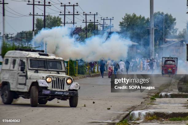 Protesters throwing stones on a police vehicle during clashes on Saturday after Eid ul-fitr Prayers in Srinagar. Government Forces in Indian...