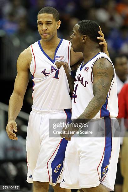 Xavier Henry and Sherron Collins of the Kansas Jayhawks react in the second half while taking on the Texas Tech Red Raiders during the quarterfinals...