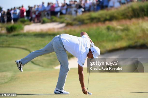 Rickie Fowler of the United States marks his ball on the 11th green during the third round of the 2018 U.S. Open at Shinnecock Hills Golf Club on...