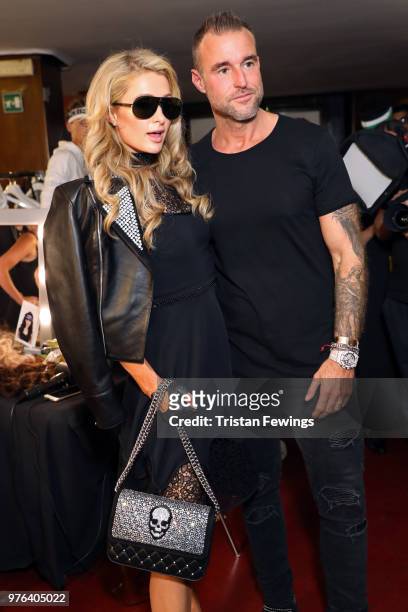 Paris Hilton and Philipp Plein are seen backstage ahead of the Plein Sport show during Milan Men's Fashion Week Spring/Summer 2019 on June 16, 2018...