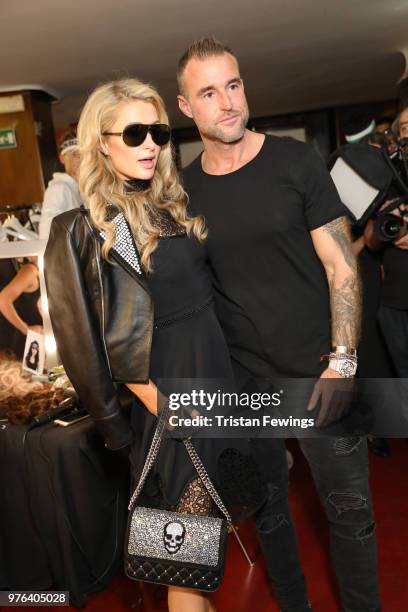 Paris Hilton and Philipp Plein are seen backstage ahead of the Plein Sport show during Milan Men's Fashion Week Spring/Summer 2019 on June 16, 2018...