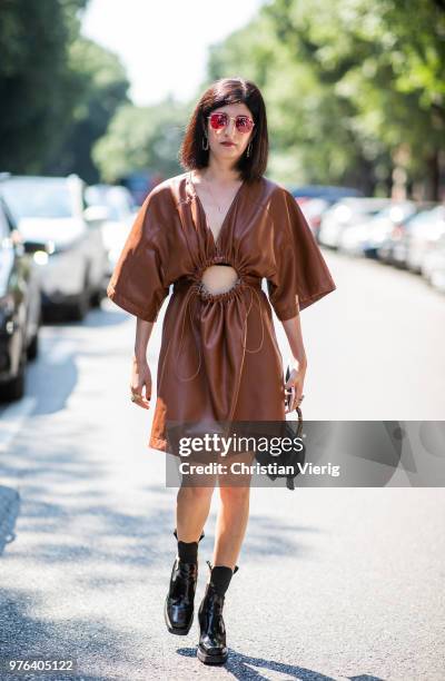 Valentina Siragusa wearing brown leather dress is seen outside M1992 during Milan Men's Fashion Week Spring/Summer 2019 on June 16, 2018 in Milan,...