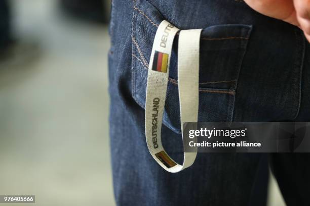 June 2018, Zirndorf, Germany: A key chain showing the German flag can be seen at the press event held at the preliminary reception shelter. Bavaria's...