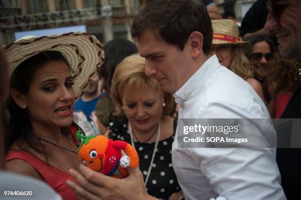 Ciudadanos party leader Albert Rivera receives a toy with the figure of 'Naranjito' , after he participated in an event to present the new platform...