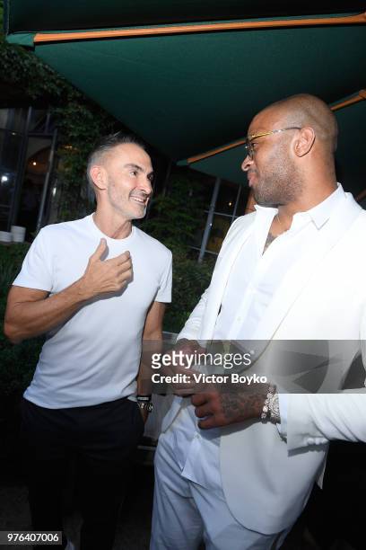 Neil Barrett and Anthony Leon P. J. Tucker attend the GQ Milan Cocktail Party during Milan Men's Fashion Week Spring/Summer 2018/19 on June 16, 2018...