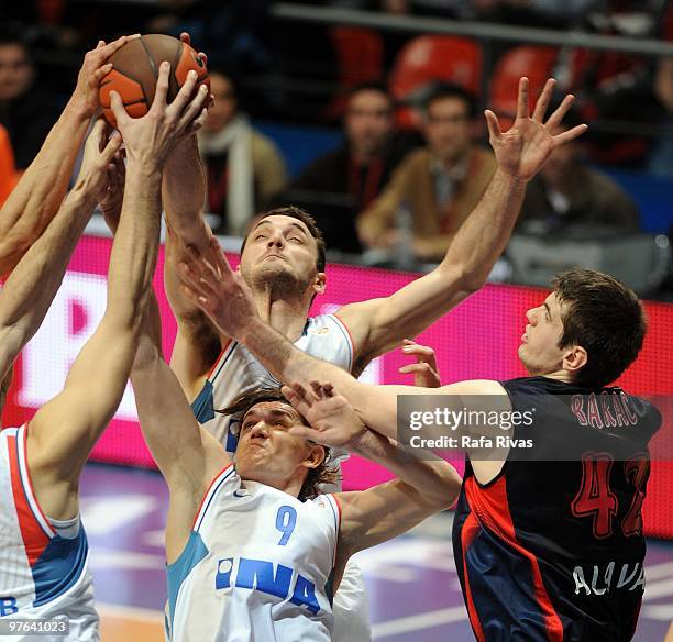 Stanko Barac, #42 of Caja Laboral competes with Robert Troha, #9 of KK Cibona Zagreb during the Euroleague Basketball 2009-2010 Last 16 Game 6...