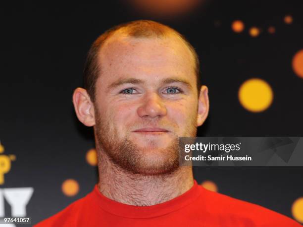 Wayne Rooney looks on after posing with the authentic FIFA World Cup Trophy as part of the FIFA World Cup Trophy Tour on March 11, 2010 at Earls...