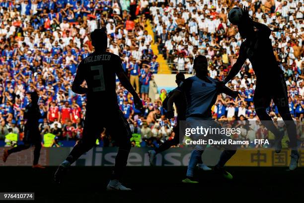 Enzo Perez of Argentina clears the ball under a challenge by Alfred Finnbogason of Iceland during the 2018 FIFA World Cup Russia group D match...