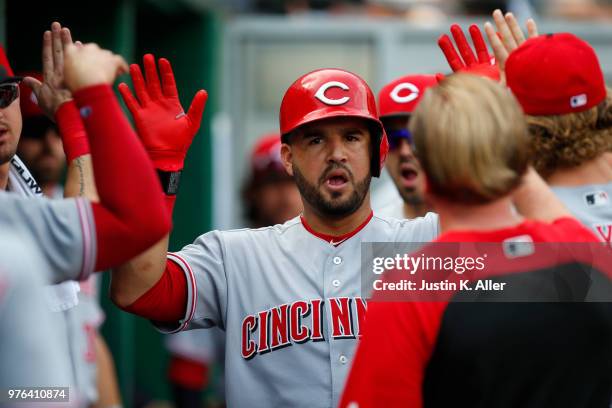 Eugenio Suarez of the Cincinnati Reds celebrates after hitting a solo home run in the second inning against the Pittsburgh Pirates at PNC Park on...