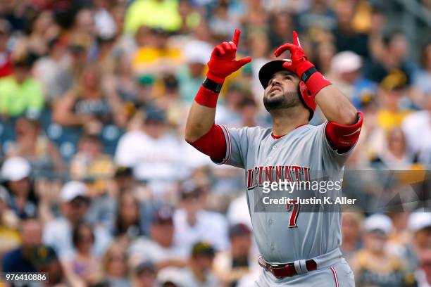 Eugenio Suarez of the Cincinnati Reds reacts after hitting a solo home run in the second inning against the Pittsburgh Pirates at PNC Park on June...
