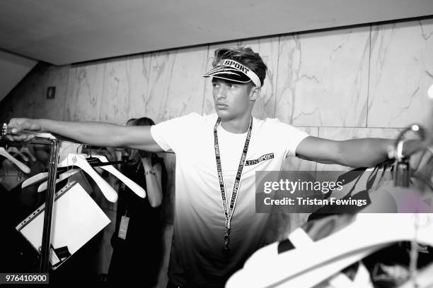 Model is seen backstage ahead of the Plein Sport show during Milan Men's Fashion Week Spring/Summer 2019 on June 16, 2018 in Milan, Italy.