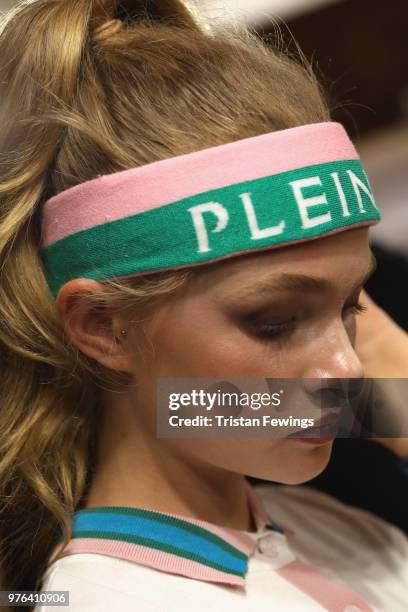 Model is seen backstage ahead of the Plein Sport show during Milan Men's Fashion Week Spring/Summer 2019 on June 16, 2018 in Milan, Italy.