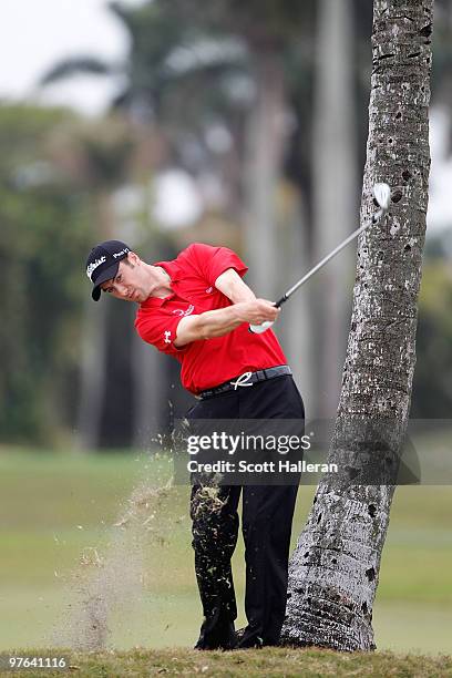 Ross Fisher of England hits is sedcond shot on the second hole during round one of the 2010 WGC-CA Championship at the TPC Blue Monster at Doral on...