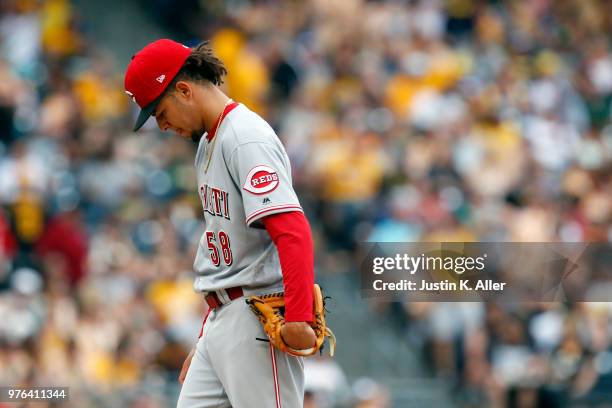 Luis Castillo of the Cincinnati Reds reacts after giving up a home run in the third inning against the Pittsburgh Pirates at PNC Park on June 16,...