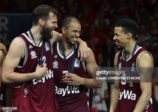 Bayern Munich's forward Danilo Barthel, Bayern Munich's forward Alex King and Bayern Munich's US guard Jared Cunningham react during the winners...