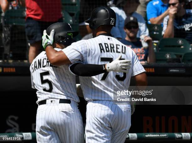 Yolmer Sanchez of the Chicago White Sox and Jose Abreu of the Chicago White Sox celebrate after the White Sox scored against the Detroit Tigers...