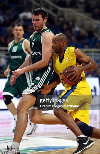 Jamon Lucas , #22 of Maroussi BC competes with Antonis Fotsis, #9 of Panathinaikos Athens during the Euroleague Basketball 2009-2010 Last 16 Game 6...