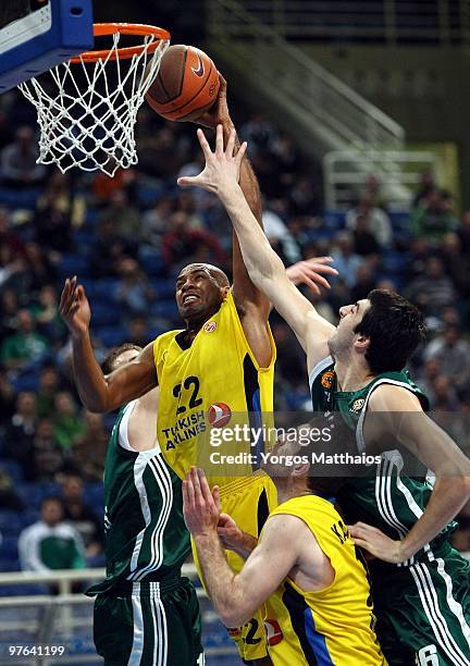 Jamon Lucas, #22 of Maroussi BC competes with Giorgi Shermadini, #16 of Panathinaikos Athens during the Euroleague Basketball 2009-2010 Last 16 Game...