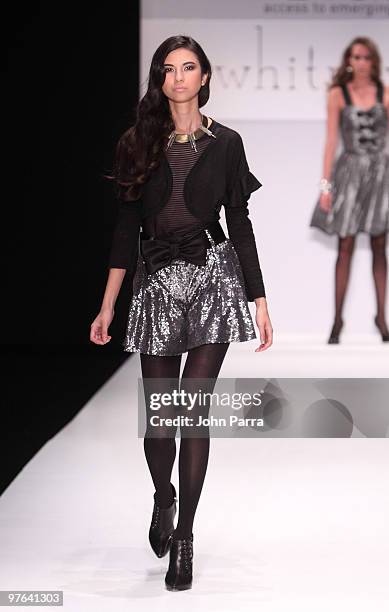 Model walks the runway at the Whitney Eve Port show during the Gen Art 6th Annual Fresh Faces in Fashion Show during the opening of FASHIONmiami at...