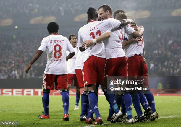 The team of Hamburg celebrates after David Jarolim scored his team's third goal during the UEFA Europa League round of 16 first leg match between...