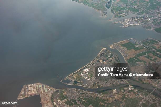 mikawa bay and tsu city in mie prefecture in japan daytime aerial view from airplane - tsu stock pictures, royalty-free photos & images