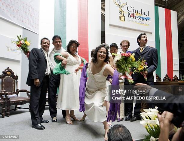 Angel Licona and his groom Josafat Perez, Judith Vazquez and her bride Lol Kin Castaneda, Ema Villanueva and her bride Janice Alba and Temistocles...