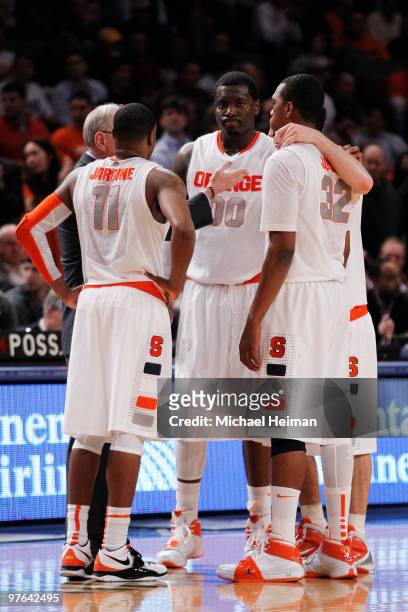 Rick Jackson of the Syracuse Orange huddles with his team against the Georgetown Hoyas during the quarterfinal of the 2010 NCAA Big East Tournament...