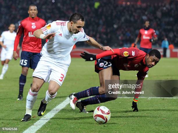 Nabil El Zhar of Liverpool competes with Aurelien Chedjou of Lille during the UEFA Europa League, first leg match between Lille and Liverpool at...