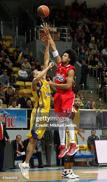 Josh Childress, #6 of Olympiacos Piraeus competes with Kelly McCarty, #21 of BC Khimki Moscow Region in action during the Euroleague Basketball...