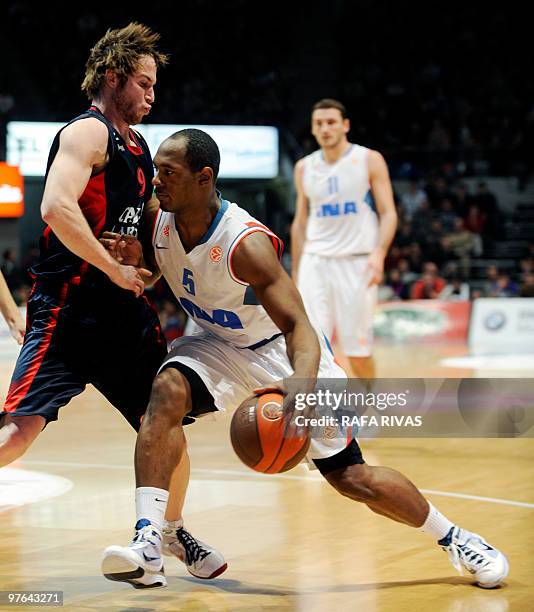 Caja Laboral's Marcelinho Huertas vies with Cibona Zagreb's Jamont Gordon during a Euroleague basket match, on March 11 at Fernando Buesa Arena in...