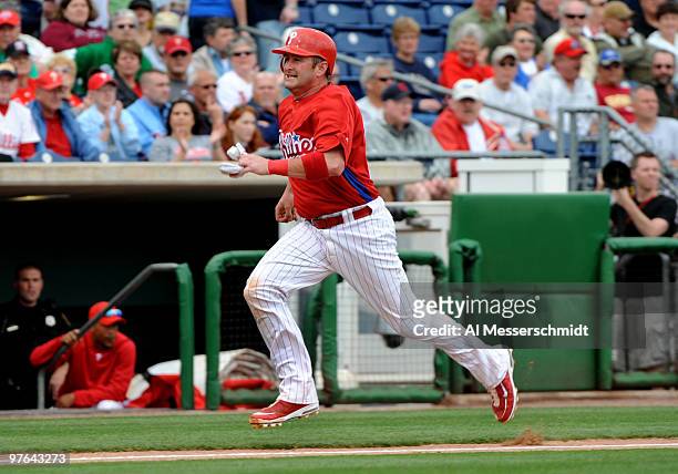 Catcher Brian Schneider of the Philadelphia Phillies scores the first run against the Detroit Tigers March 11, 2010 at the Bright House Field in...