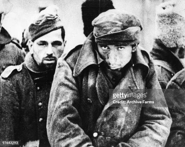 German prisoners huddle with soldiers from other Axis satellite countries, against the sharp winds of the Russian winter, after the defeat ot the...