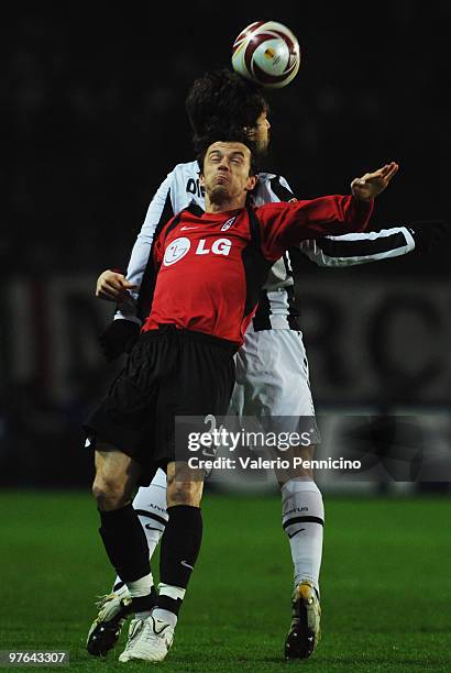 Ribas Da Cunha Diego of Juventus FC battles for the ball with Simon Davies of Fulham FC during the UEFA Europa League last 16, first leg match...