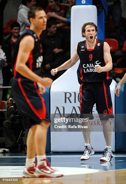 Marcelinho Huertas, #9 of Caja Laboral celebrates after winning next to Carl English, #23 of Caja Laboral during the Euroleague Basketball 2009-2010...