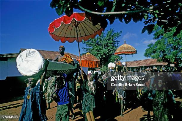 Africa,Ghana,two tribal chieftains of the Ga Adangbe tribe are carried into Odumase-Krobo town square at the start of the annual harvest festival of...