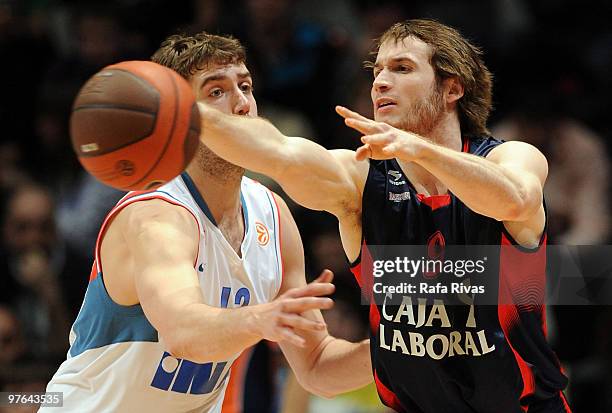 Marcelinho Huertas, #9 of Caja Laboral competes with Luksa Andric, #12 of KK Cibona Zagreb during the Euroleague Basketball 2009-2010 Last 16 Game 6...