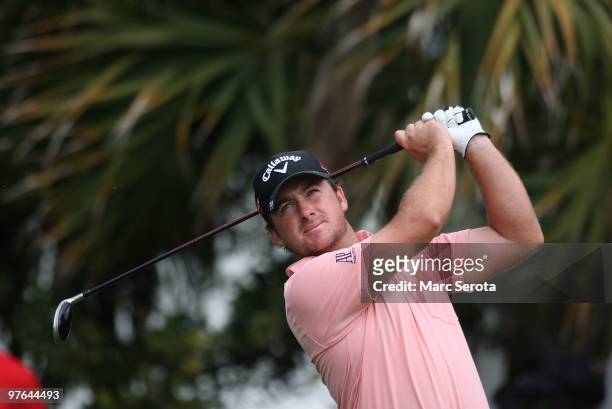 Graeme McDowell of Northern Ireland tees off on the 13th tee box during round one of the 2010 WGC-CA Championship at the TPC Blue Monster at Doral on...