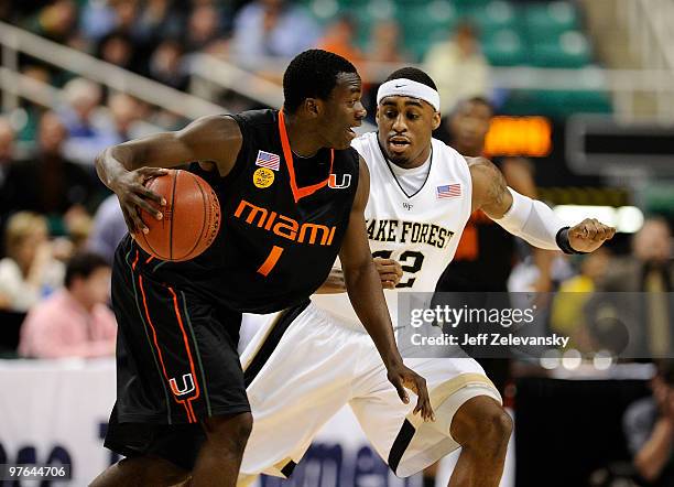 Williams of the Wake Forest Demon Deacons guards Durand Scott of the University of Miami Hurricanes in their first round game in the 2010 ACC Men's...