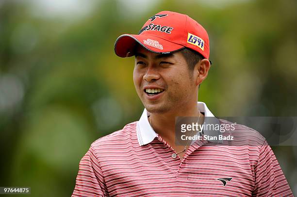 Yuta Ikeda of Japan smiles on the practice range during the first round of the World Golf Championships-CA Championship at Doral Golf Resort and Spa...